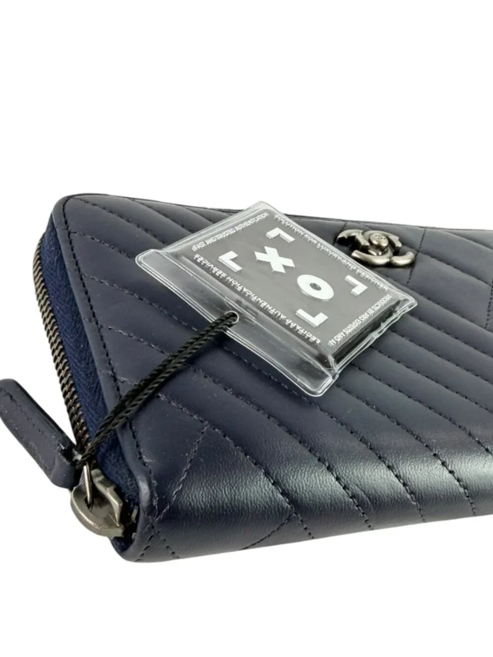 CHANEL Authentic Chevron and Diamond Quilted Navy Blue Leather Zippy Wallet